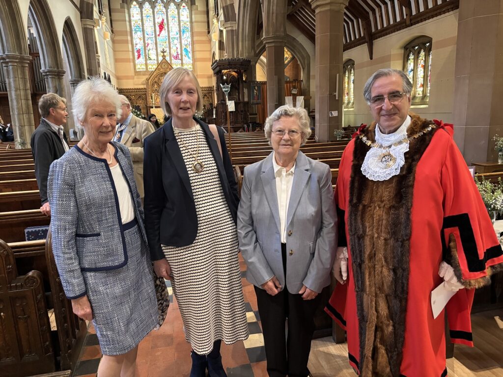 Barnet parish church nave filled with orchestra and choir for annual commemoration day service for Queen Elizabeth's Girls' School