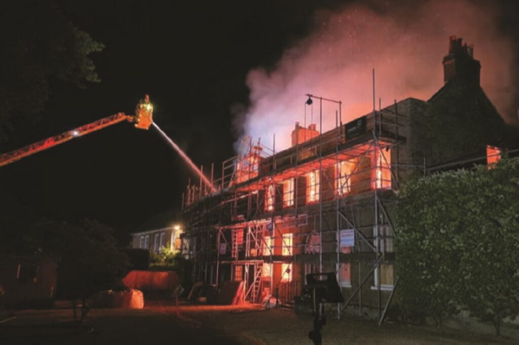 Work about to begin removing charred debris piled high inside Georgian house on Hadley Green gutted in fire last May.